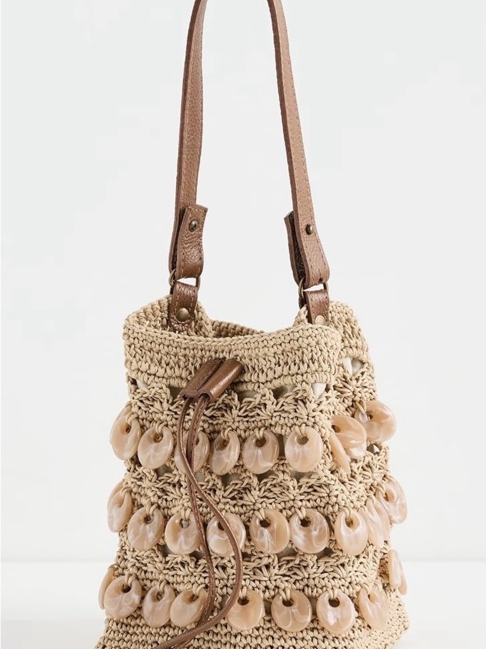 Handwoven Raffia Crossbody Bucket Bag in Natural/Tan with acrylic shell accents